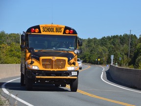 A school bus crosses the bridge over the Vermillion River on Panache Lake Road on Tuesday afternoon.