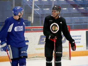 Sudbury Wolves graduate Isaak Phillips, right, shares a laugh with current Wolves defenceman Dylan Robinson during a skate at Sudbury Community Arena in Sudbury, Ontario on Monday, Aug. 29, 2022.