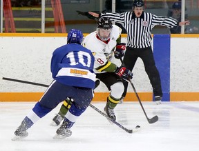 Powassan Voodoos forward Liam Serviss (8) battles for a puck with Greater Sudbury Cubs forward Miguel Renaud (10) during the Cubs' NOJHL season opener at the Gerry McCrory Countryside Sports Complex in Sudbury , Ontario, on Thursday, September 8, 2022.
