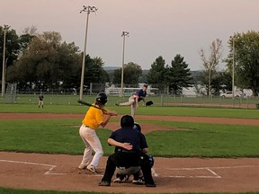 Petawawa pitcher Nathan Clouthier uncorks a pitch to Pembroke A’s shortstop Josh Coleman in Ottawa Valley Baseball League action.  Clouthier went the distance, throwing a shutout as Petawawa evened the best of three semi-final series at one game apiece. The deciding game will be played Monday at 7 p.m. at Riverside Park.