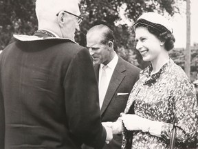 Mayor Walter Harry greets Prince Philip and Queen Elizabeth II at Clergue Park in July 1959. FILE