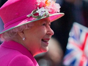 In this file photo taken on April 20, 2016 Britain's Queen Elizabeth II smiles as she arrives to open a bandstand at Alexandra Gardens in Windsor, west of London, the day before her 90th birthday. PHOTO BY JUSTIN TALLIS/AFP VIA GETTY IMAGES