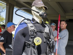 A mannequin dressed in scuba diving equipment is seen during the first-ever Quinte Watersports Fair held at the Lions Club Pavilion in ZwickÕs park on Saturday. ALEX FILIPE