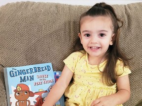 Aria Croft is shown with a book from Dolly Parton's Imagination Library.  The Kiwanis Club of Chatham-Kent is handling the program locally.  Children under five can have a book delivered to them each month.  (Handout/Postmedia Network)