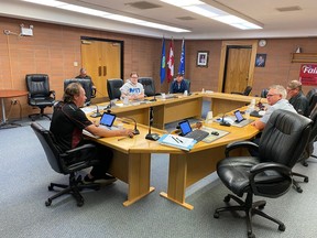(Left side of table, left to right) Mayor Gordon MacLeod, Councillors Amanda Golob and Paul Buck. (Behind on left side) Director of Public Works Garry Leathem. (Right side of table) Councillors Chris Laue (above) and Tim Schindel (below).