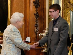 Tyler Bailer with Queen Elizabethh II in 2016.