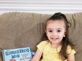 Aria Croft is shown with a book from Dolly Parton's Imagination Library.  The Kiwanis Club of Chatham-Kent is handling the program locally.  Children under five can have a book delivered to them each month.  (Handout/Postmedia Network)