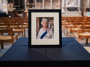 A portrait of Queen Elizabeth II is placed in York Minster in York, England on Sept. 9 after it was announced that she had died.. Queen Elizabeth II died at Balmoral Castle in Scotland on Sept. 8, and is succeeded by her eldest son, King Charles III. (Photo by Ian Forsyth/Getty Images)