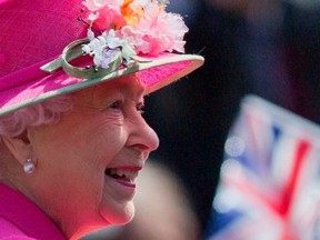 In this file photo taken on April 20, 2016 Britain's Queen Elizabeth II smiles as she arrives to open a bandstand at Alexandra Gardens in Windsor, west of London, the day before her 90th birthday. PHOTO BY JUSTIN TALLIS/AFP VIA GETTY IMAGES