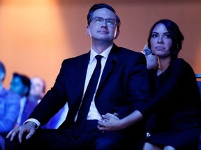 Leadership candidate Pierre Poilievre and wife Anaida Poilievre look on during Canada's Conservative Party leadership election in Ottawa, Ontario, Canada September 10, 2022. PHOTO BY BLAIR GABLE/REUTERS