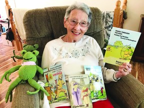 Angela Haine displays her recently published fourth book in the Toads Through the Ages series, "Hobbly and Wobbly: Rescue in Nottingham." The Devon author will give a reading of all four books at the Devon Public Library on Wednesday, September 21. (Marc Haine)