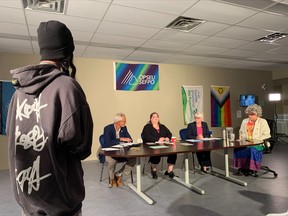 An Indigenous youth asks the three mayoral candidates, Peter Chirico, Leslie McVeety and Johanne Brousseau, a question during the first election debate Wednesday evening at the Canadian Union of Public Employees hall. The debate was organized by North Bay Pride.