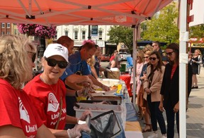 Chefs from the Local Community Food Center and volunteers with Sun Life Financial in Stratford served up a pulled pork lunch at the United Way Perth-Huron's campaign launch event in Market Square Friday.  (Galen Simmons/The Beacon Herald)