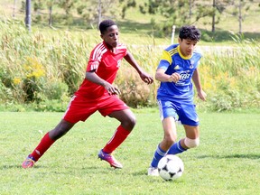David Akero, left, of the GSSC Impact pursues Anushan Kidnapilai of CTSA Jarvis during U14 boys soccer action at James Jerome Sports Complex in Sudbury, Ontario on Saturday, September 10, 2022.