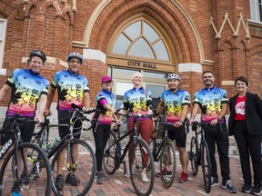 Melanie Cressman, right, Director of Operations for United Way HPE, is joined alongside cyclists participating in the annual Bike 4 United Way fundraising event outside of Belleville City Hall on Friday. ALEX FILIPE