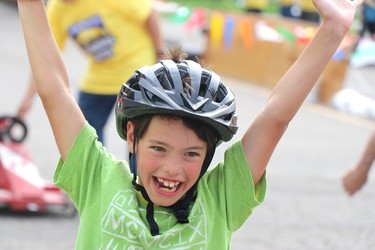 William MacKenzie celebrates his second place finish at Lake Superior Soap Box Derby at Elim Pentecostal in Sault Ste. Marie, Ont., on Saturday, Sept. 17, 2022. (BRIAN KELLY/THE SAULT STAR/POSTMEDIA NETWORK)