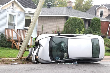 Sault Ste. Marie Police Service investigates a single-vehicle collision near 348 Farwell Terrace in Sault Ste. Marie, Ont., on Saturday, Sept. 17, 2022. (BRIAN KELLY/THE SAULT STAR/POSTMEDIA NETWORK)