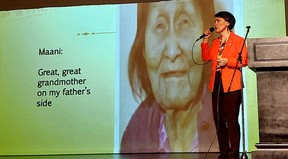 Susan Aglukark sings a song during her NOMAD: Correcting the Narrative presentation held in Chatham on Sept. 15 as an image of her great-great grandmother Maani, who chose her Inuit name Uuliniq, is displayed on a screen.  Ellwood Shreve/Postmedia