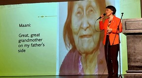 Susan Aglukark sings a song during her NOMAD: Correcting the Narrative presentation held in Chatham on Sept. 15 as an image of her great-great grandmother Maani, who chose her Inuit name Uuliniq, is displayed on a screen. Ellwood Shreve/Postmedia