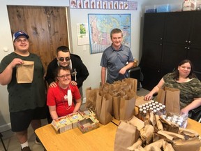 REACH Centre participants with meals prepared for Owen Sound Police Service detainees.