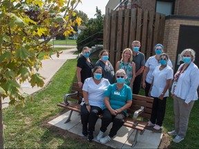 Healthcare workers celebrate a relaxing enrichment of the landscape at St. Marys Memorial Hospital.  One Bench One Tree, an Ontario-based volunteer group working to install a bench and plant a tree in every hospital in the country, recently announced four projects in Huron and Perth counties.  Chris Montanini/Stratford Beacon Herald