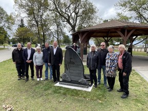 Nipissing First Nation Chief Scott McLeod, North Bay Mayor Al McDonald, and some of their council members at the monument marking the naming of Shabogesic Beach.