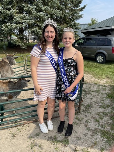 From left: 2022 Lucknow Fall Fair senior ambassador Michelle Angst, 19, and junior ambassador Rylan Wheeler, 12 check out the petting zoo at the fair on Sept. 17.