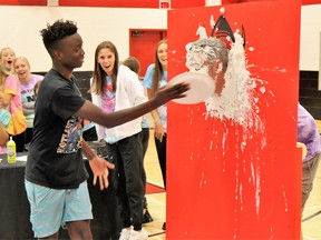 Ninth-grade Northern Collegiate student Zikora Anyaegbuna throws a pie in the face of vice principal Nathan Jeffrey as part of the school’s Terry Fox Walk day on Sept. 22.
Carl Hnatyshyn/Sarnia This Week