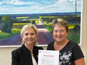 Fort Saskatchewan Mayor Gale Katchur, left, and Councillor Birgit Blizzard pose for a photo with the Rail Safety proclamation, recognizing Sept. 19 to 25 as Rail Safety Week in Fort Saskatchewan. Photo Supplied.