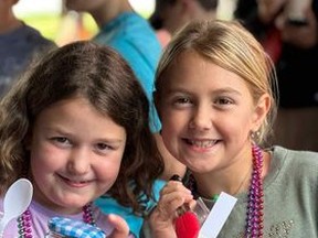 Lauryn Georgiev and Brinley Aspin pose for a picture during the Annual World Greatest Bake Sale in Support of the Terry Fox Foundation. The young bakers raised more than $3,570.