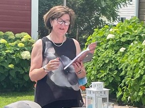 Author Dawn Dube reading during her book launch earlier this summer at the beautiful, award-winning Whitewater Inn in Beachburg.