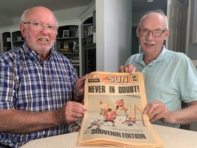 Jim Dillon (left) of Delhi and David Douglas of Waterford hold a special edition of the Toronto Sun that was published following Team Canada's victory in the 1972 Canada-Soviet Union Summit Series. The two men were among the 3,000 Canadians who went to the Soviet Union to see the final four games of the eight-game series.