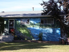 Spruce Grove resident, Mary Scott, is the proud owner of the community's first home to be painted by Edmonton-based muralist Robert Murray. Photo by Rudy Howell/Postmedia.
