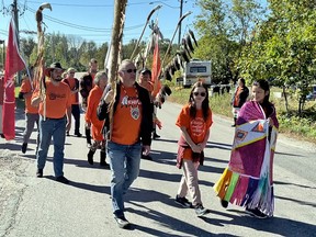 Nipissing First Nation Chief Scott McLeod leads a parade honouring residential school survivors on Friday, the National Day for Truth and Reconciliation.