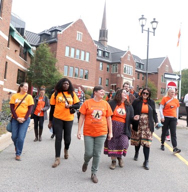 Krista McCracken, researcher/curator ofShingwauk Residential Schols Centre, leads a walk near Shingwauk Hall to Bellevue Park on Friday, Sept. 30, 2022 in Sault Ste. Marie, Ont. (BRIAN KELLY/THE SAULT STAR/POSTMEDIA NETWORK)