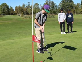 Pascal Paquette, 13, left, of Ecole St. Paul, and teammates Mikko Toivonen, 13, and Hector Sauve, 13, participated in the Conseil scolaire catholique Nouvel annual elementary school golf tournament at the Twin Stacks Golf Club in Coniston, Ont. on Thursday September 29, 2022. A total of 68 Grade 7 and 8 students took part in the friendly tournament.