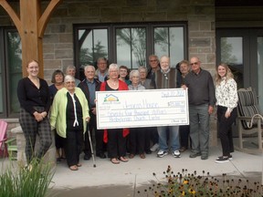 A portion of the proceeds from the sale of Exeter's Caven Presbyterian Church, which closed in June 2021, was recently donated to Jessicas House Hospice, and members of the church gathered recently at Jessicas House to make the donation of $74,174.72. Front from left are Jessicas House co-ordinator of volunteer and bereavement services Grace Winbow, Donna Perry, Bill Wheeler, Dorothy Henderson, Bernice Thompson, John Henderson, Keith Strang and Jessicas House community relations and fund development co-ordinator Bre Thompson; back from left are Barb Dalrymple, Sandi Strang, Marten Dykstra, Laurie Dykstra, Carol Finlayson, Murray Finlayson and Elsie Willis. Scott Nixon