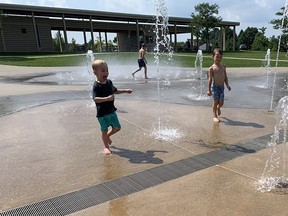 Children cavort in the water at Chatham's Kingston Park in this photo from August 2021. Postmedia