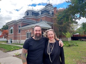 Arryn and Heather Blumberg are seen in front of a former funeral home they bought in Dresden. Their renovation of the 38-room home will be the focus of a six-part series 'We Bought A Funeral Home' that debuted Oct. 1 on discovery+. Ellwood Shreve/Postmedia