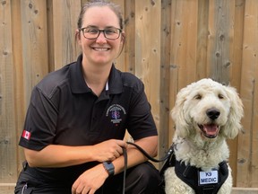 Nicole Selby, Haldimand County paramedic, is joined by Tanner, the county’s full-time service dog. Selby is Tanner’s handler in the county’s Community Paramedic Wellness Dogs program.