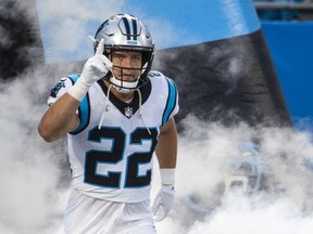 Christian McCaffrey of the Carolina Panthers runs onto the field before taking on the Pittsburgh Steelers during an NFL preseason game at Bank of America Stadium on August 27, 2021 in Charlotte, North Carolina.