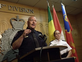 Regina police Chief Evan Bray, left, speaks while RCMP Assistant Commissioner Rhonda Blackmore, right, looks on during a press conference at RCMP "F" Division Headquarters in Regina on Monday, Sept. 5, 2022. An ongoing manhunt for the remaining suspect in a stabbing spree that shattered a small Saskatchewan community is raising fresh questions about rural policing in Canada. Police are continuing to search for Myles Sanderson. THE CANADIAN PRESS/Michael Bell