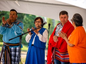 Rick Wilson, Alberta's Indigenous Relations Minister, is honoured by Fort McKay Métis Nation in a blanketing ceremony on Aug. 20, 2022. Image supplied by Fort McKay Métis Nation