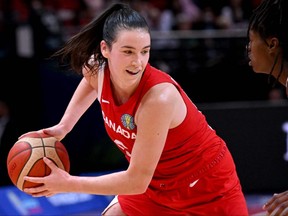 Canada's Bridget Carleton looks to pass the ball during the 2022 FIBA Women's Basketball World Cup quarter-final match against Puerto Rico at Sydney Superdome on September 29, 2022, in Sydney. (Photo by WILLIAM WEST/AFP via Getty Images)