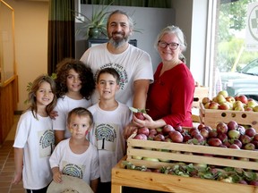 Phil Beauchamp from Beautiful Field Farm in Naughton, back row left, and Rachelle Rocha from Seasons Pharmacy and Culinaria in Sudbury, back row right, pose for a photo with Kelly Beauchamp, Eddy Beauchamp, Andi Beauchamp and Alessio Foladore alongside locally grown apples during Applefest activities at Seasons Pharmacy and Culinaria, located at 815 Lorne St., on Saturday, September 10, 2022. A collaboration with Sudbury Shared Harvest, Applefest featured apple tasting and pressing and children's activites at Seasons, as well as tours and talks at the nearby Delki Dozzi Community Food Forest. For more information, visit www.sudburysharedharvest.ca/applefest.