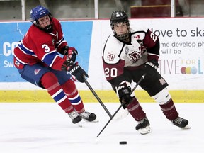 Chatham Maroons' Matthew Cunningham (20) is chased by Strathroy Rockets' Cole Smith (3) in the second period at Chatham Memorial Arena in Chatham, Ont., on Sunday, Sept. 18, 2022. Mark Malone/Chatham Daily News/Postmedia Network