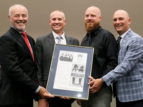 Bob Stafford, left, Ben Curtis, Mark Patterson and Ed DeSchutter are inducted into the Chatham Sports Hall of Fame in Chatham, Ont., on Thursday, Sept. 22, 2022. Their Chatham Granite Club rink won the 2009 Dominion curling men's club championship. Mark Malone/Chatham Daily News/Postmedia Network