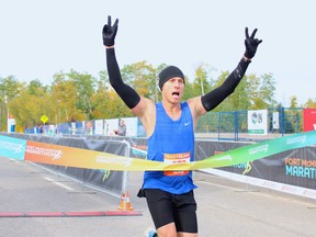 Ben Jansen wins the men's portion of the the Fort McMurray Marathon after crossing the finish line at MacDonald Island Park on Sunday, September 25, 2022. Vincent McDermott/Fort McMurray Today/Postmedia Network
