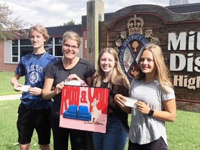 Mitchell District High School teacher Melanie Mallinson recently presented business entrepreneurial studies students Evan O'Rourke (left), Libby Jubinville and Kate Drost with $100 prizes they won through a class project for entrepreneurship at the tail end of the last school year. Jubinville holds a painting of the Roo & You logo she created, the business that assisted with the project and provided the funds for the winners. SUBMITTED