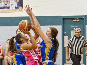 Leanne Moore of St. John's College drives to the hoop during an AABHN senior girls basketball game against McKinnon Park Secondary School at SJC on Tuesday.